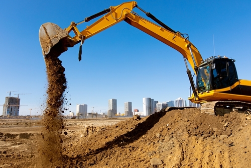 Crawler,excavator,machine,unloading,sand,or,soil,at,construction,area